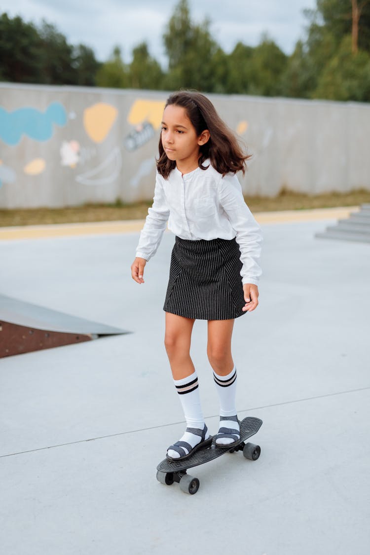 A Girl Riding A Penny Board