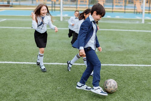 Free Children Having Fun Playing Soccer Stock Photo