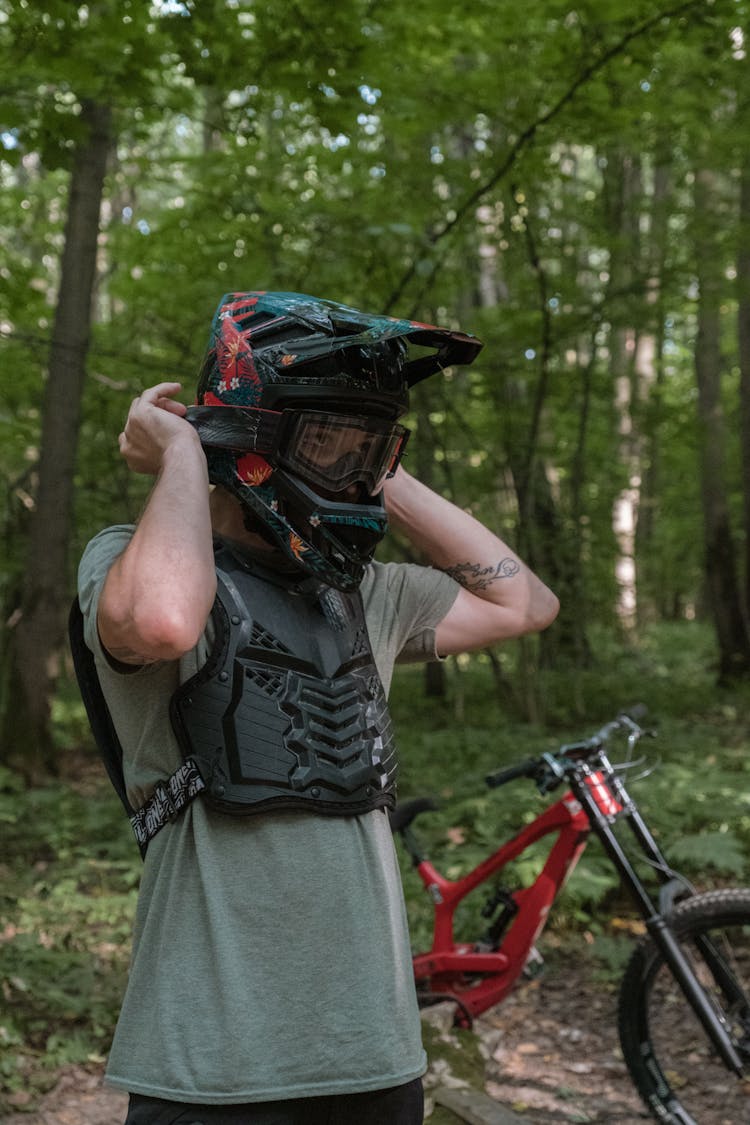 A Man Wearing A Bicycle Helmet