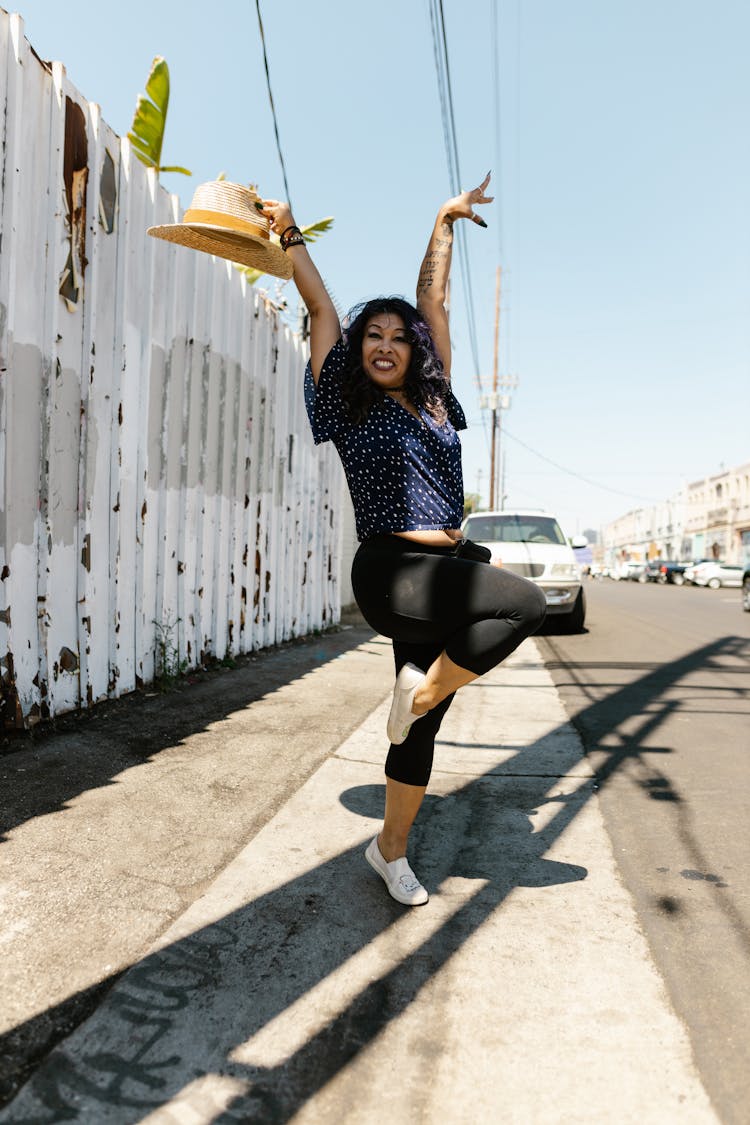 A Woman Dancing In The Street