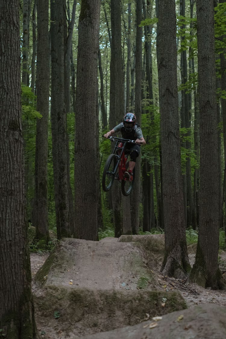 A Person On A Mountain Bike Mid Air