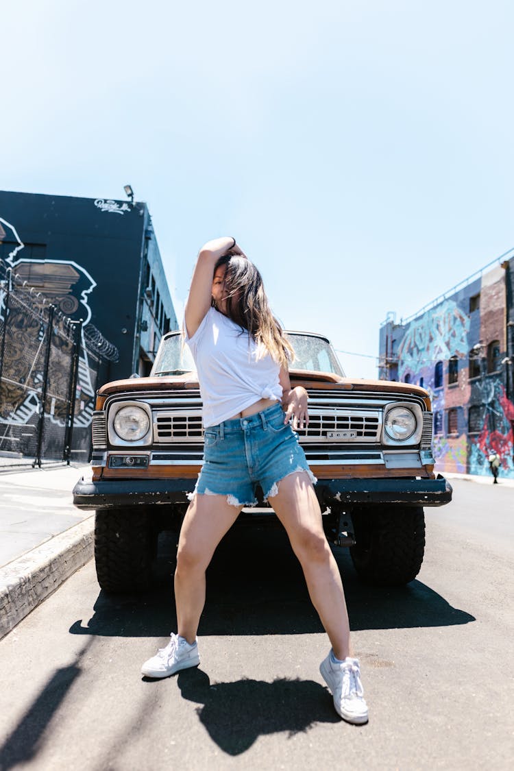 Woman In White Shirt Dancing On The Street