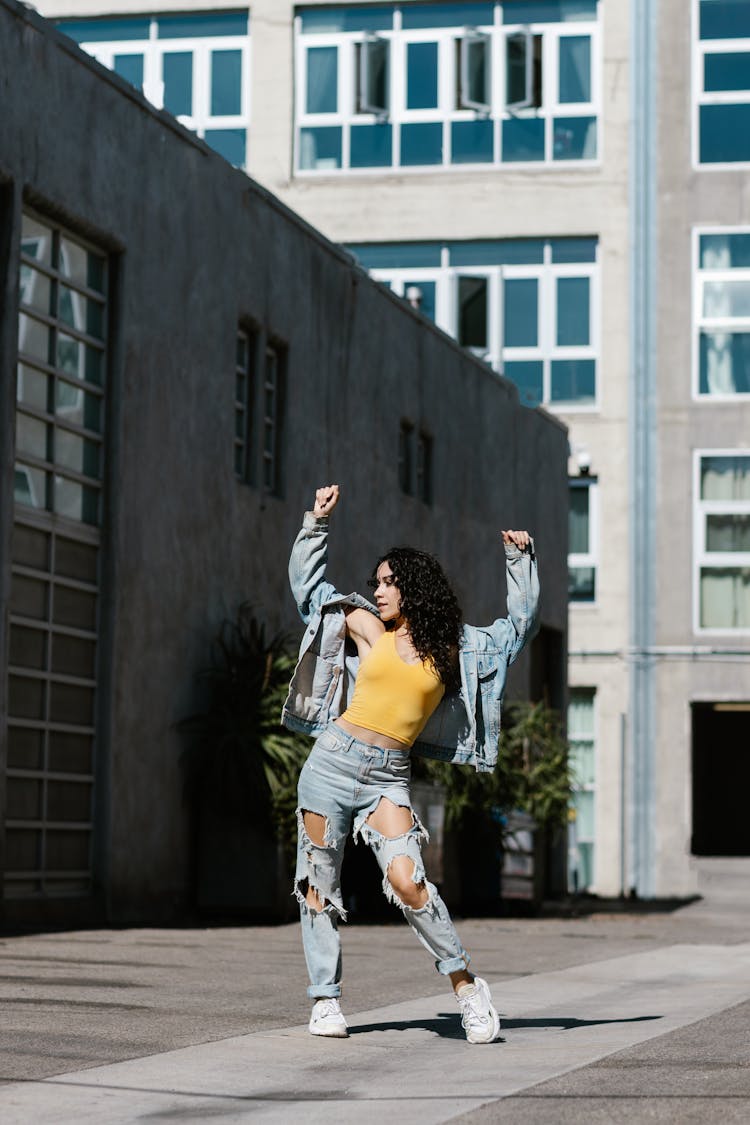 Woman In Denim Jacket Dancing