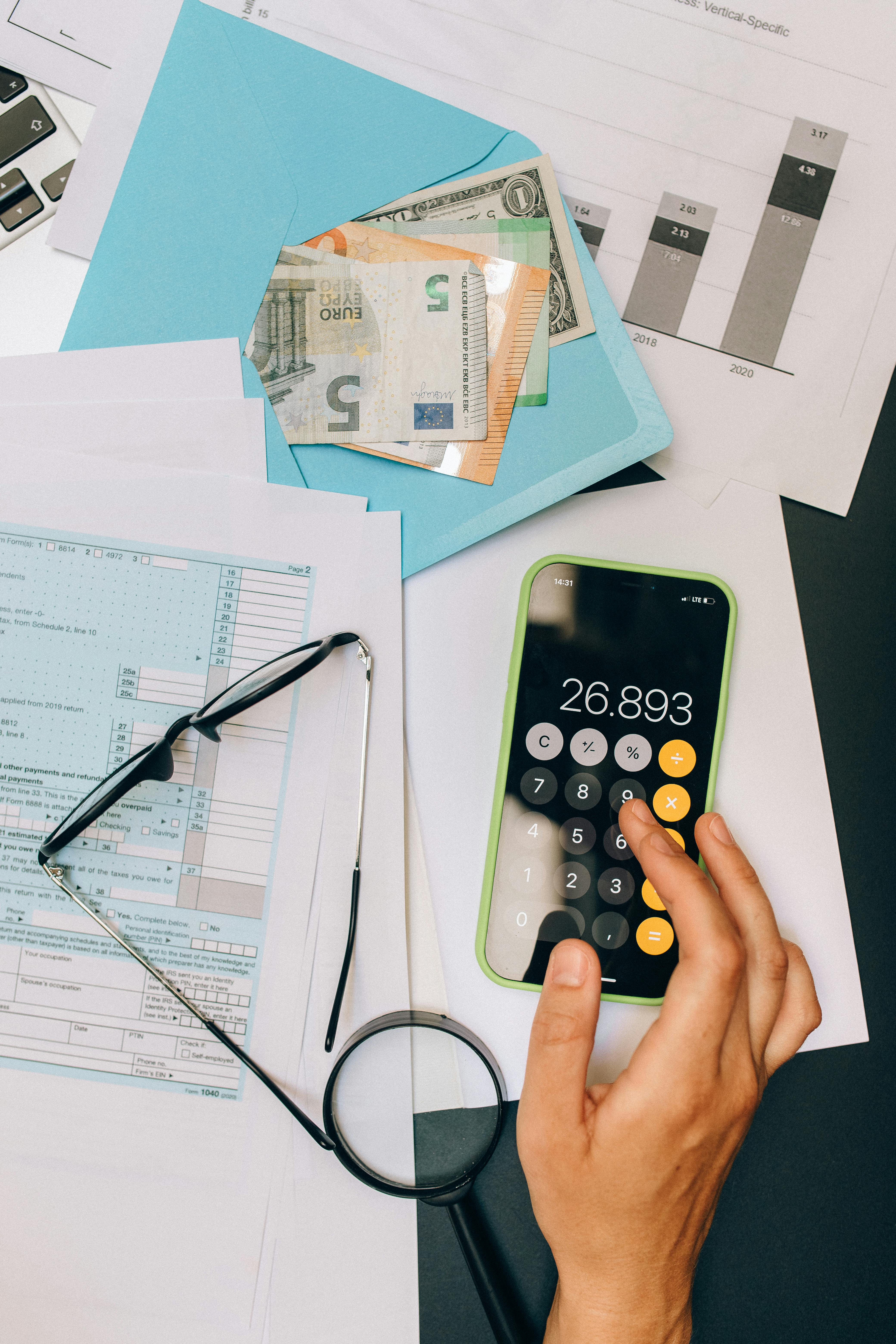 a person computing using a calculator