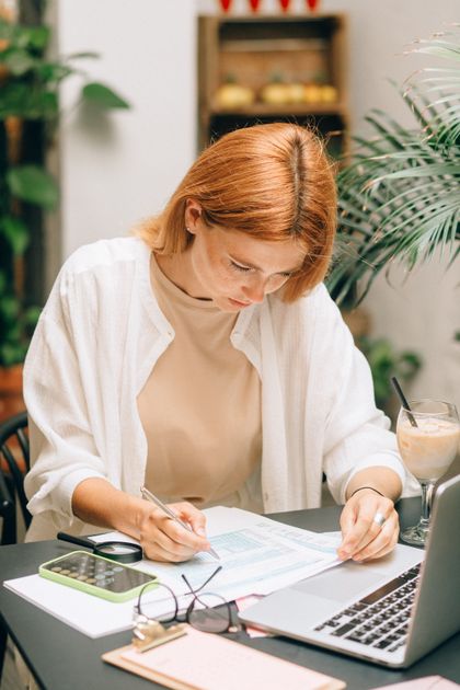Woman analyzing financial documents at a desk — HELOC rates 2026