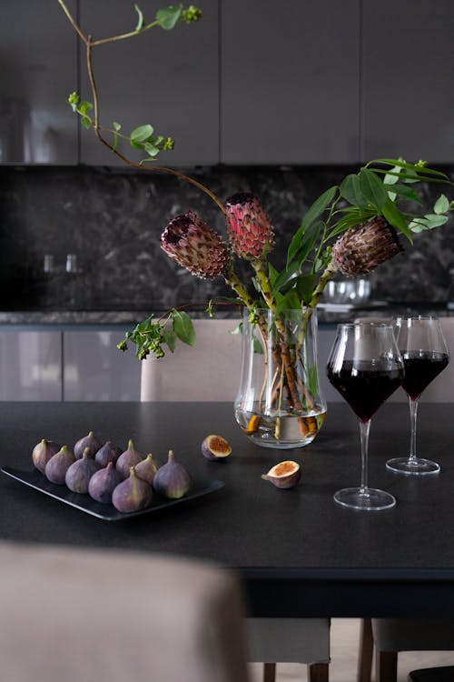 Figs and Glasses of Wine on a Dining Table