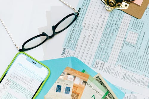 Free Income Tax Return Form Beside Black Eyeglasses Stock Photo
