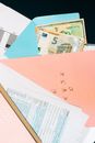 White Print Paper Beside Money