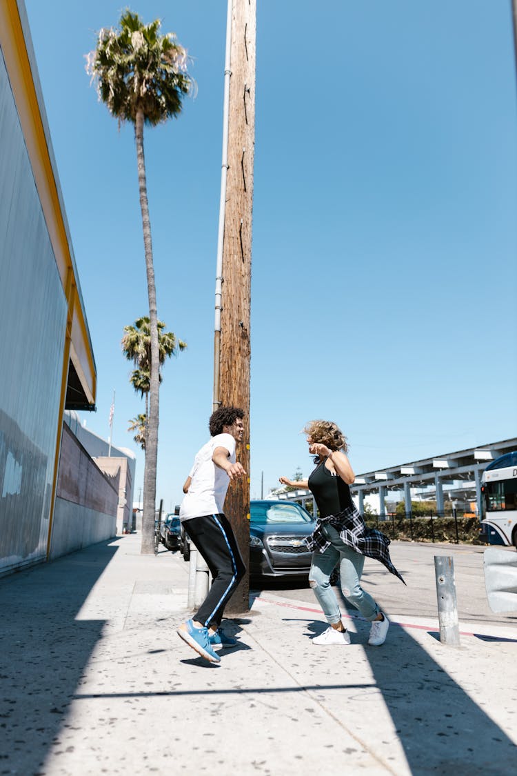 Man And Woman Dancing On The Street