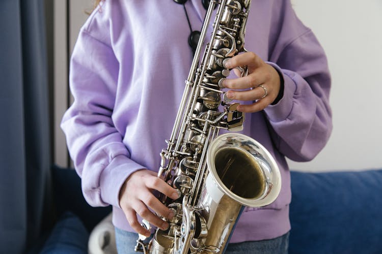 A Saxophonist In A Purple Sweater