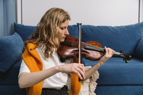 A Woman Playing a Bowed String Instrument
