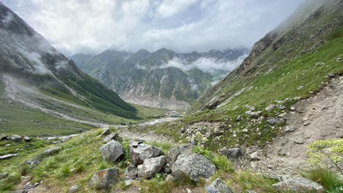 Free Green Mountains Under White Clouds Stock Photo