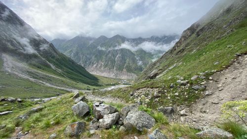 Free Breathtaking view of mountains and lush valley in Kabardino-Balkaria, Russia with misty clouds. Stock Photo