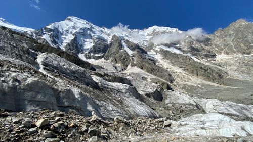 Free Breathtaking view of snow-covered peaks and rugged terrain in Russia's Caucasus region. Stock Photo