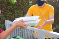 Person in Yellow Crew Neck T-shirt Reading Book