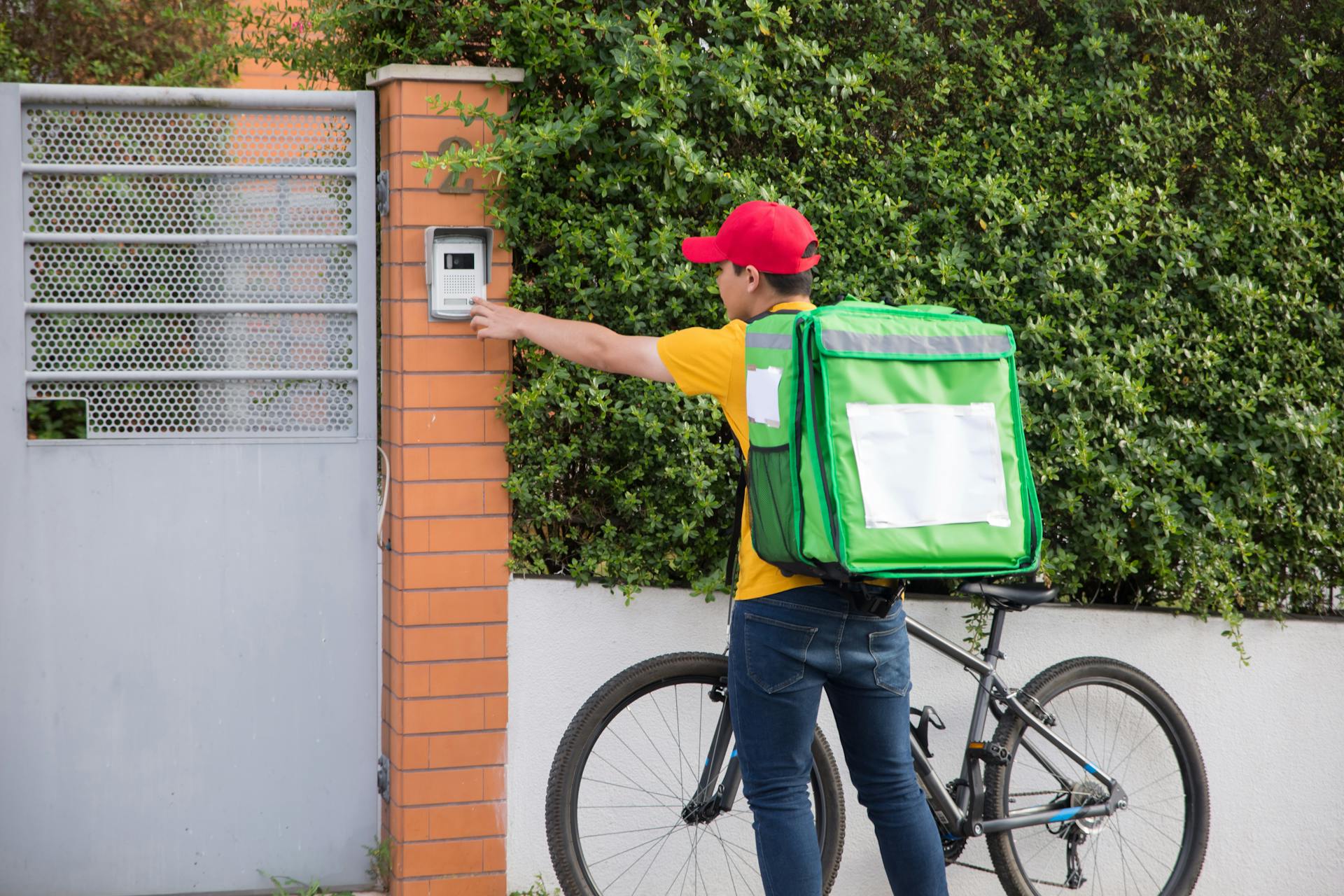 Delivery Man Clicking the Doorbell