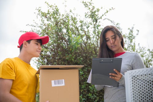 Free A Woman Receiving a Package Stock Photo