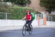 Man in Green Long Sleeve Shirt Riding on Black Bicycle
