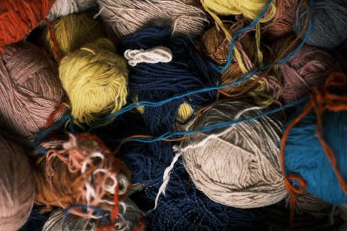 Colorful Sewing Threads in Close-up Photography