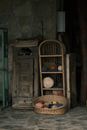 Sewing Threads on the Woven Basket and Shelf Beside the Wooden Cabinet