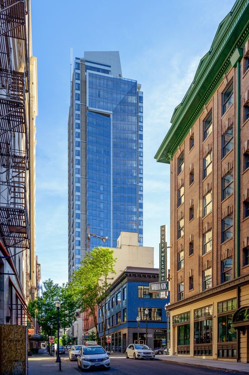 Free Tall modern skyscraper against a clear sky in an urban downtown area. Stock Photo