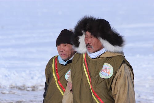 Elderly Men Wearing Warm Winter Jackets with Fur 