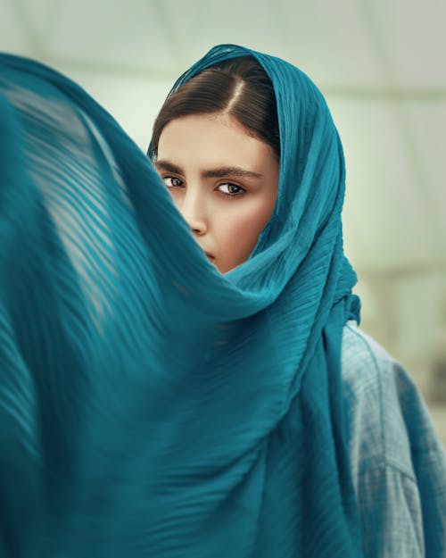 A Woman Wearing a Blue Headscarf