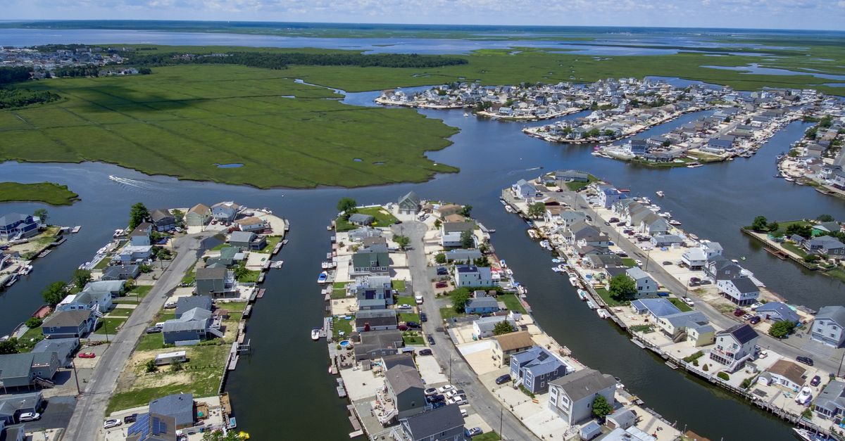 Expansive aerial view of Little Egg Harbor Township, NJ showcasing residential canals and coastline.