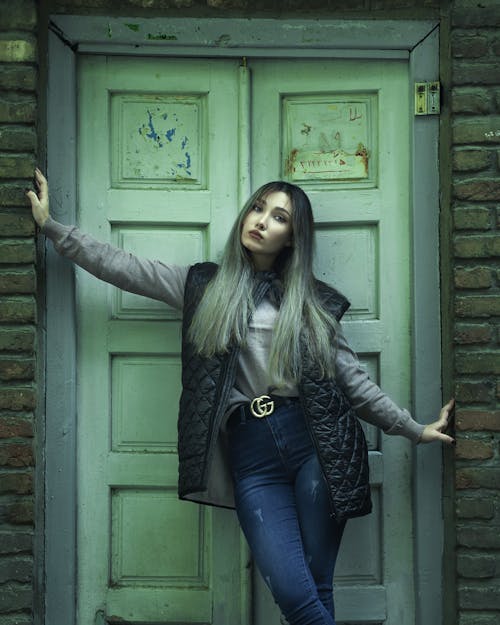 Woman Standing by the Door