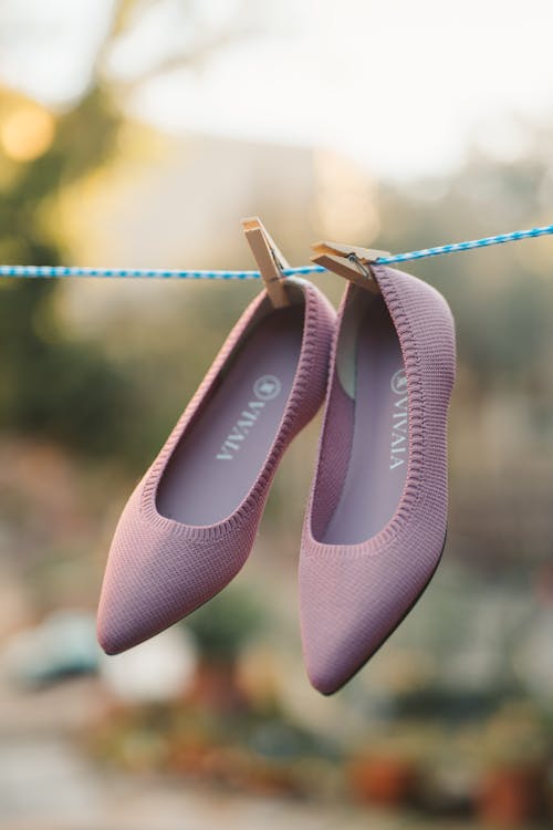 Free A Purple Sandals Hanging on a Clothesline Stock Photo