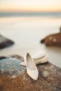 Brown Leather Flats on White Sand
