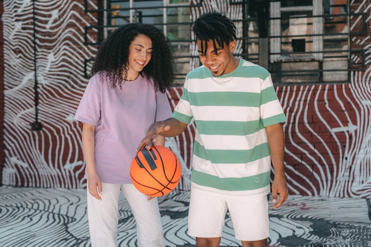 A Couple Playing Basketball Together