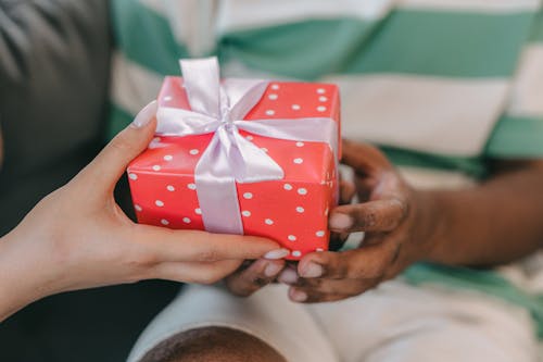 Free A Couple Holding a Present Stock Photo