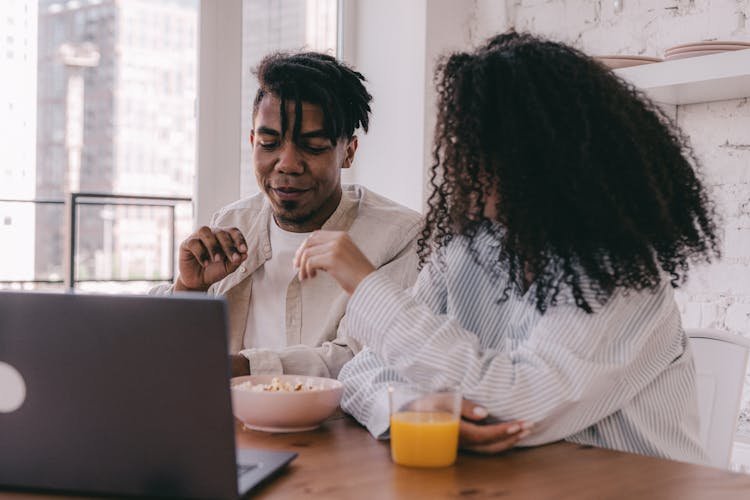 A Couple Sitting At The Table