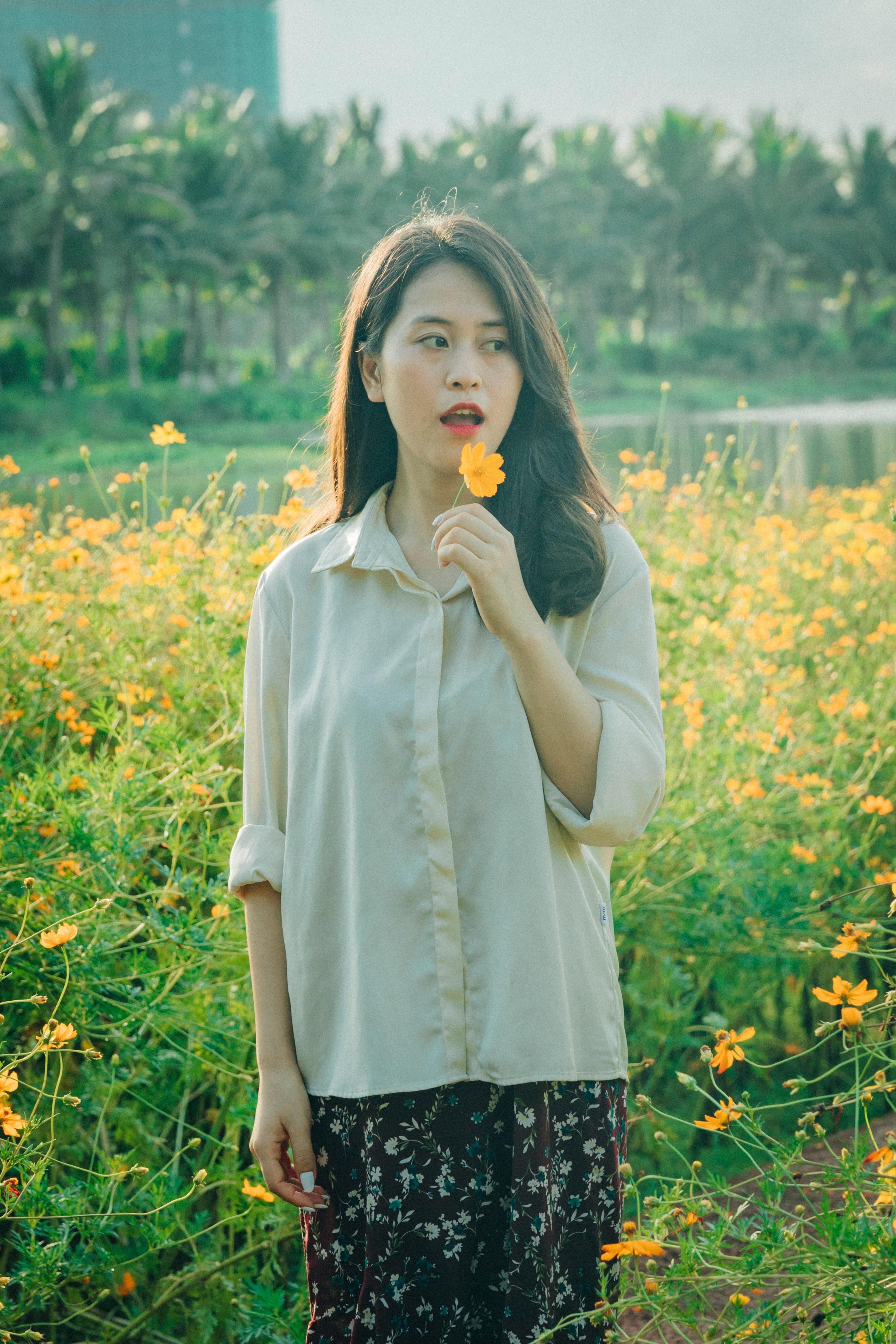 A Woman Standing in the Flower Field · Free Stock Photo