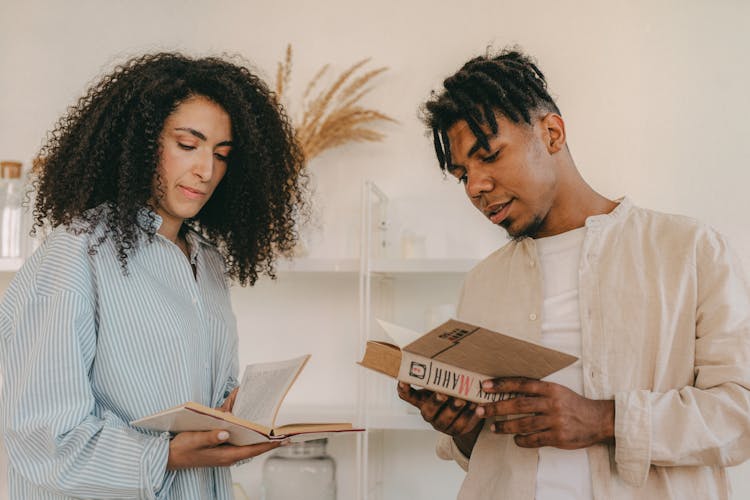 Man And Woman Reading Books 