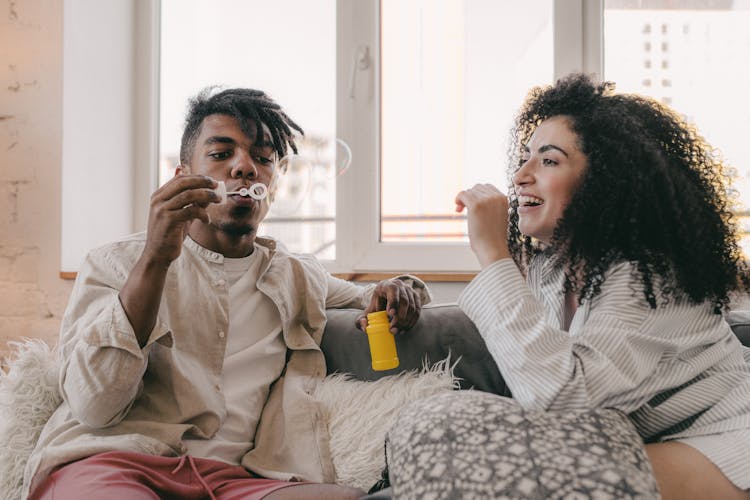 A Couple Playing With Bubbles