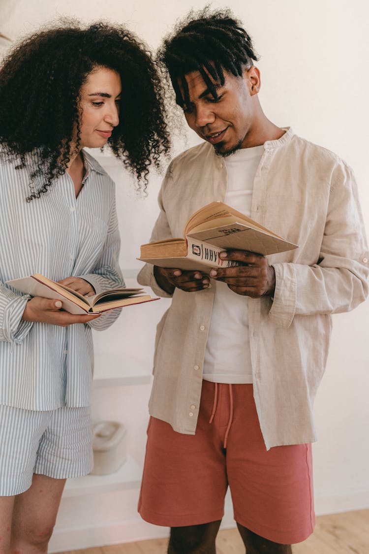 Man And Woman Reading Books