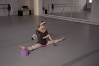 Woman in Beige Leggings Doing Split