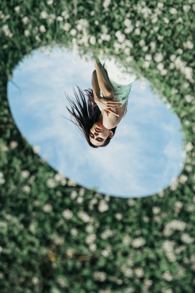 Reflection Of Woman In The Oval Mirror 