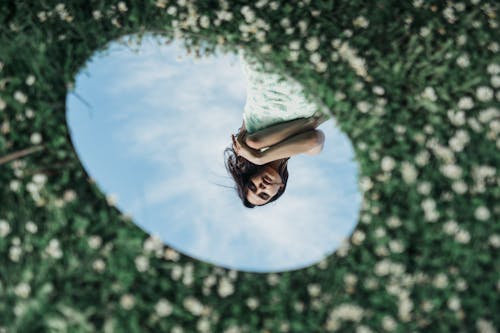 Reflection of Woman Posing in the Mirror 