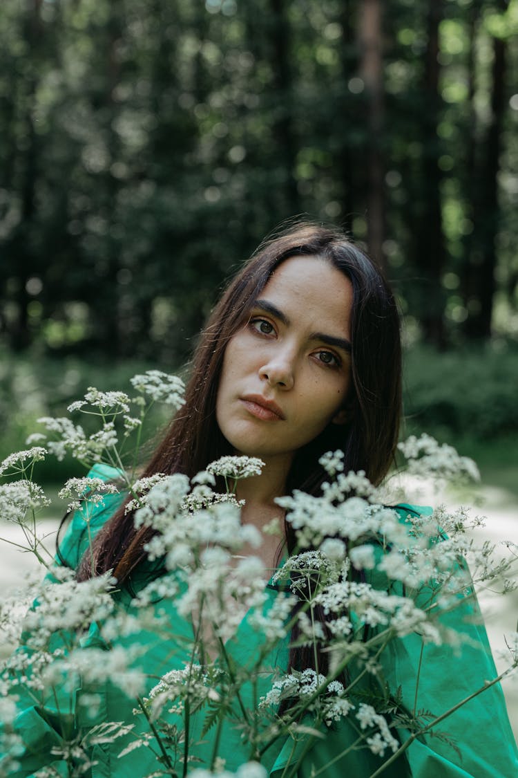 A Portrait Of Woman In Green Long Sleeves