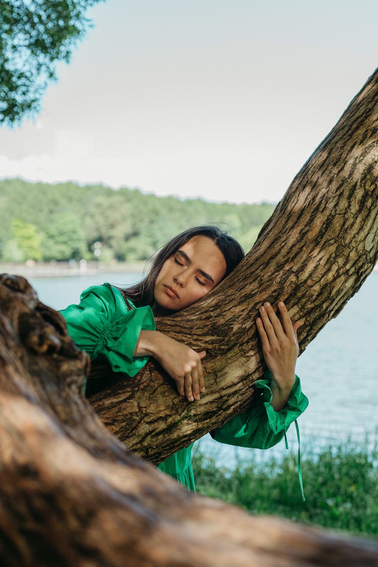 Woman Hugging A Tree