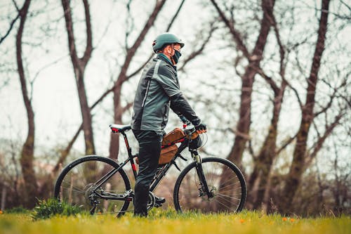 Shallow Focus of a Person Riding a Bicycle