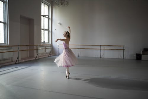 A Ballerina in a Dance Studio