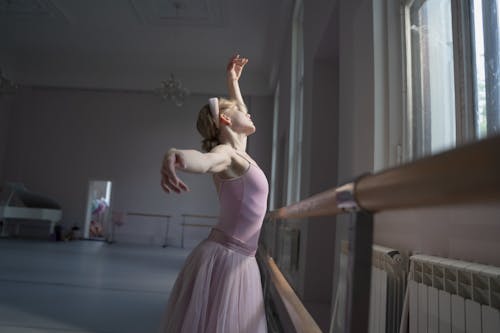 Free Woman in Purple Dress Dancing Ballet Stock Photo