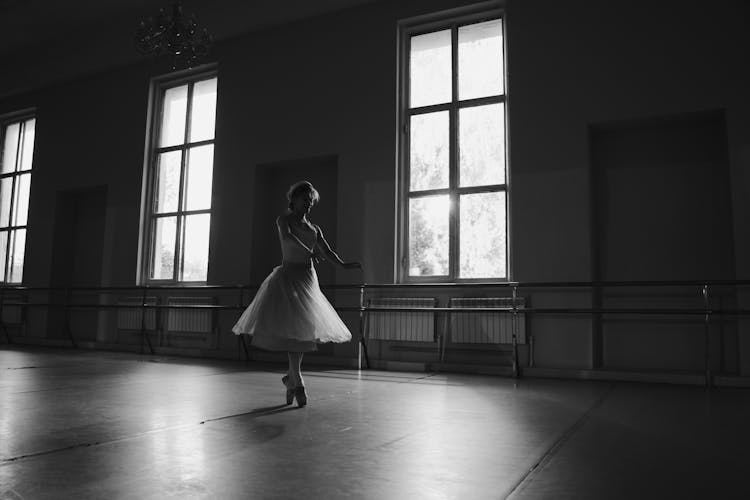 Grayscale Photo Of Woman Dancing