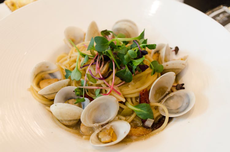 Pasta With Shellfish On White Plate