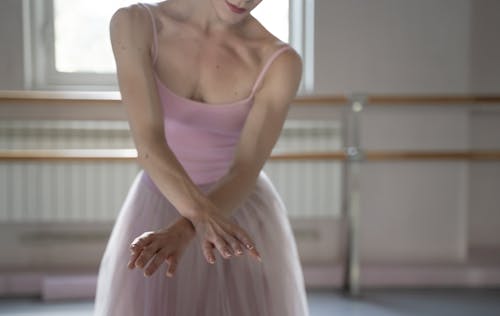 Shallow Focus of a Person Dancing while Wearing Her Pink Tutu