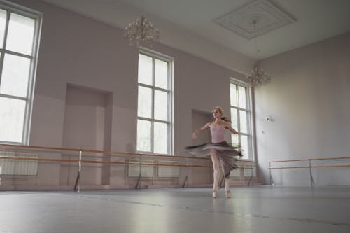 Free Woman Dancing Ballet In A Studio Stock Photo